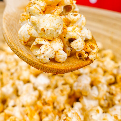 Helena is holding a spoon of truffle oil popcorn