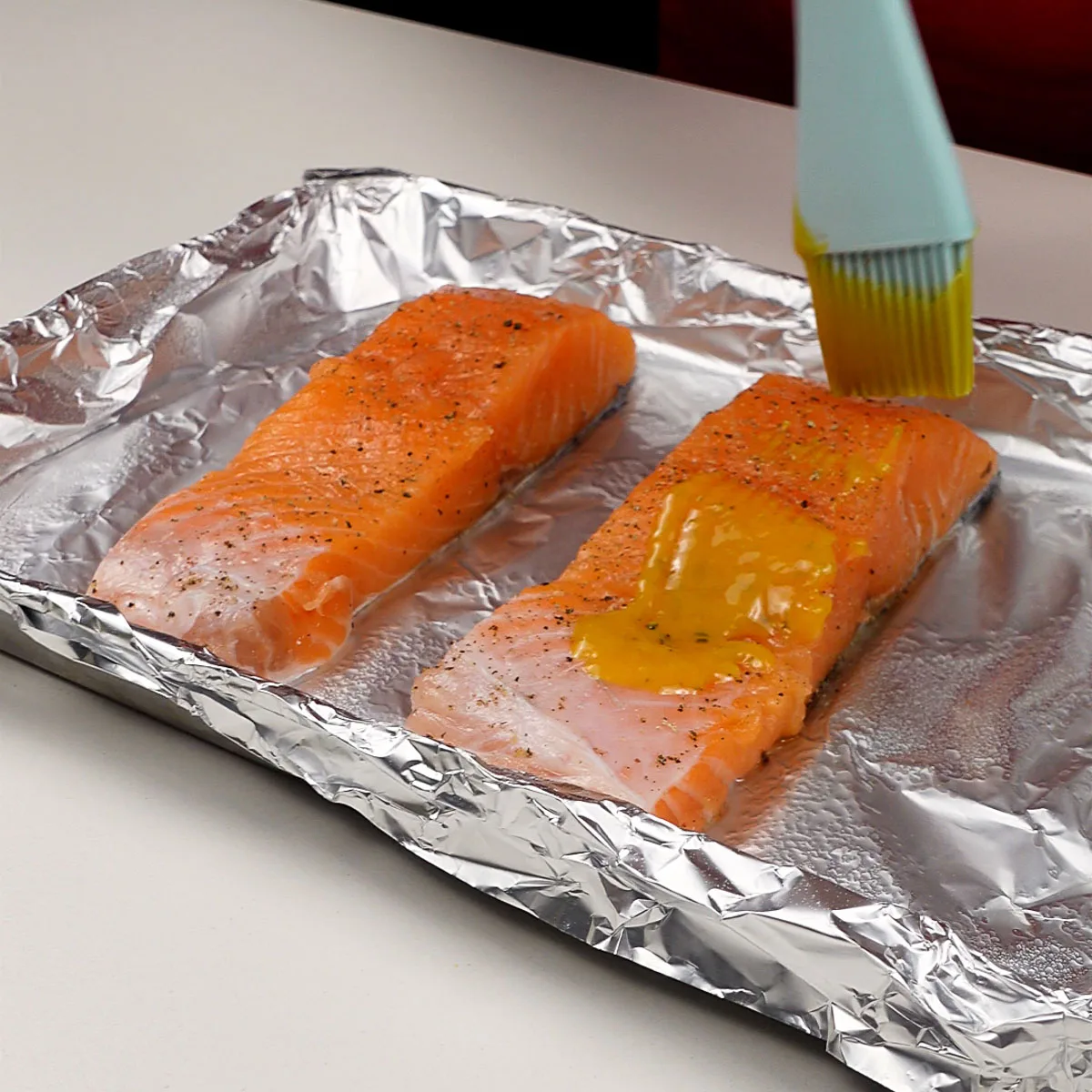 Step 2. Brush and top salmon