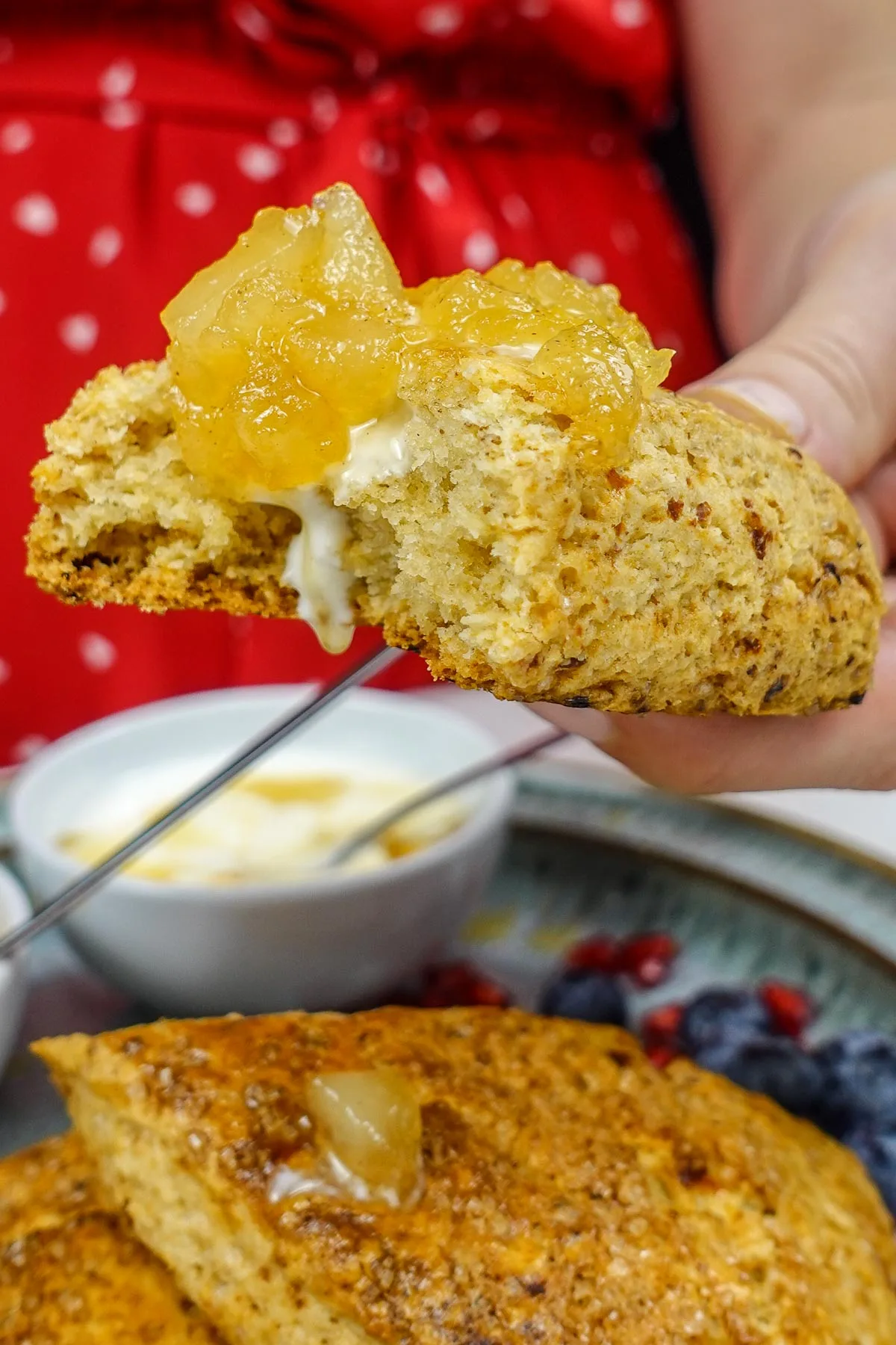 Helena is eating cottage Cheese Scone with greek yogurt and pear jam.