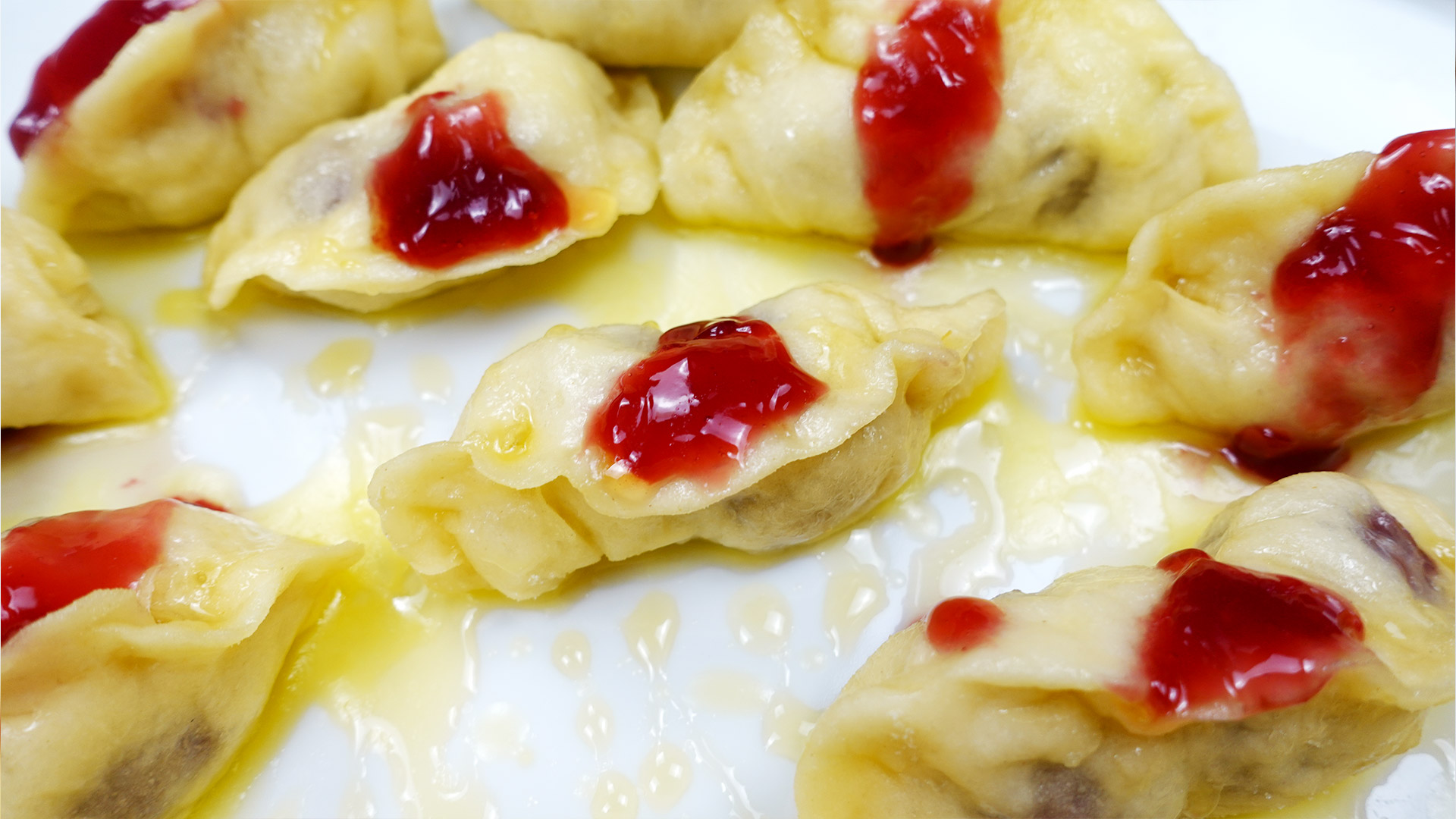 White plate with steamed cherry dumplings