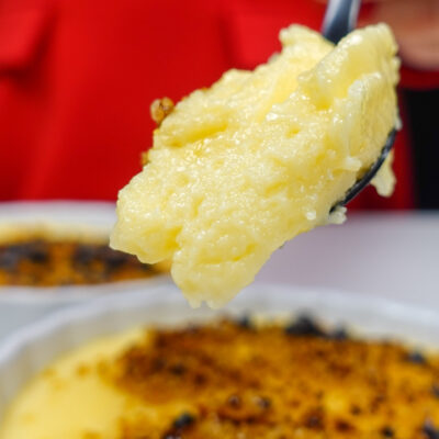 Helena is holding a spoonful with portuguese Custard cream