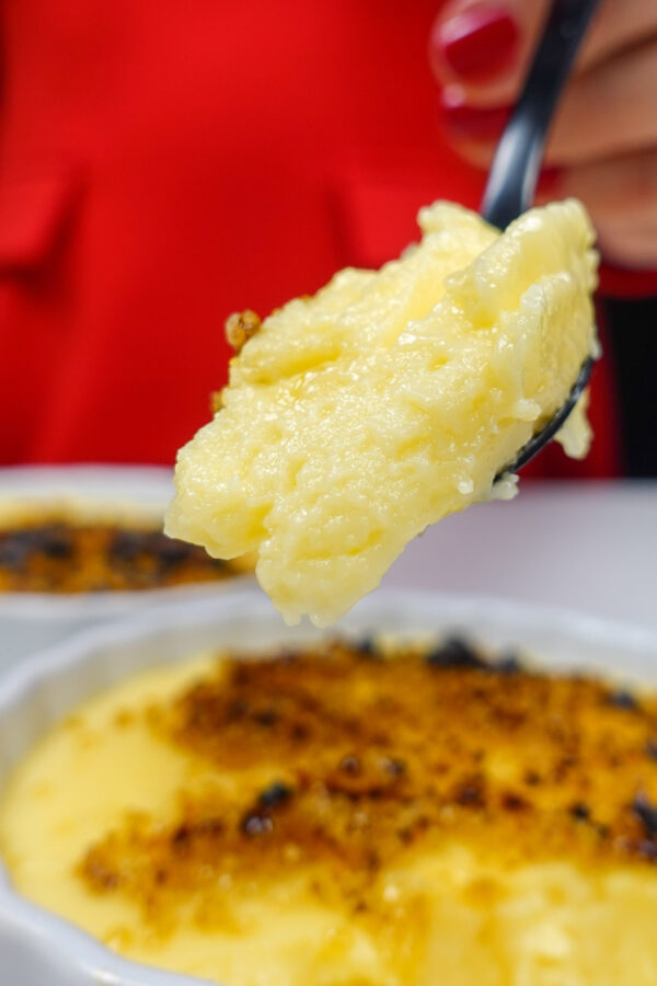 Helena is holding a spoonful with portuguese Custard cream
