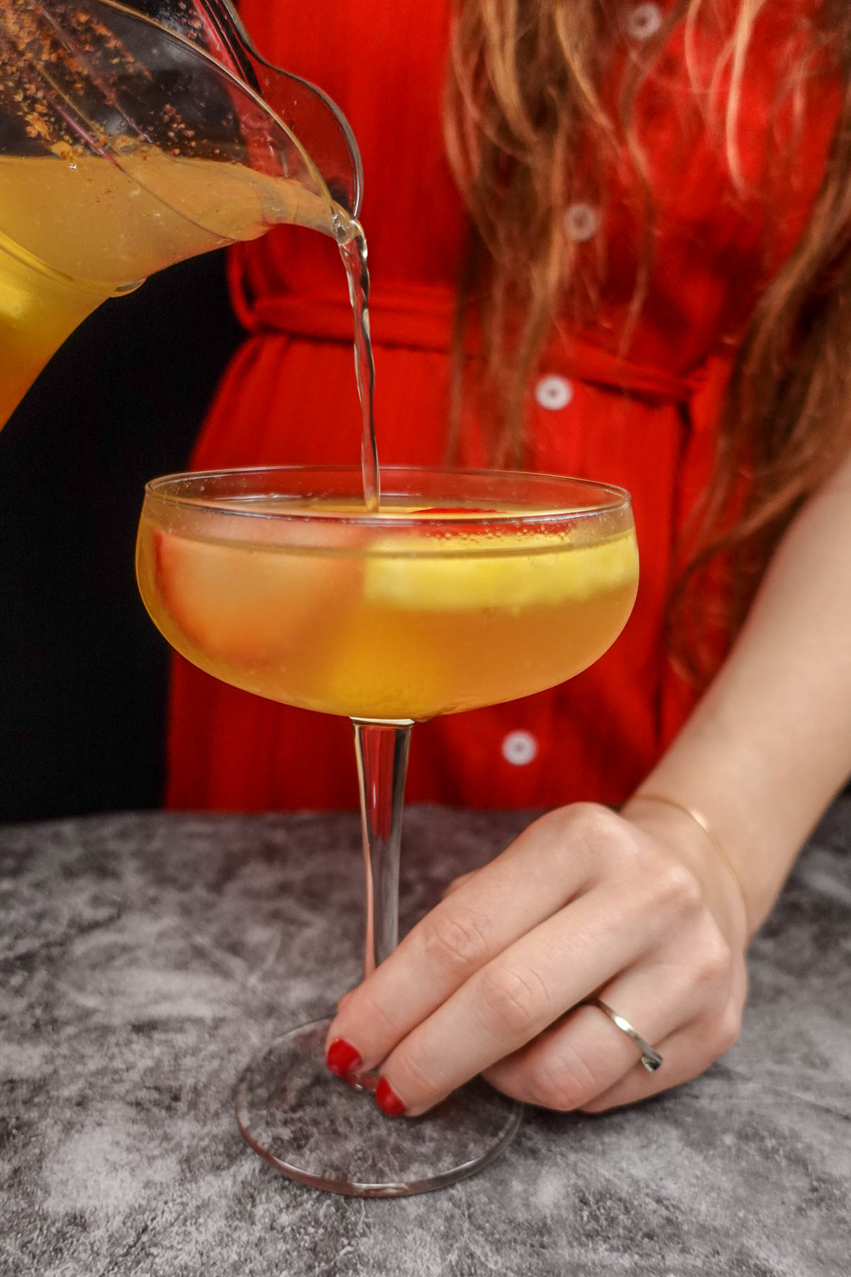 Helena is pouring a glass of white sangria