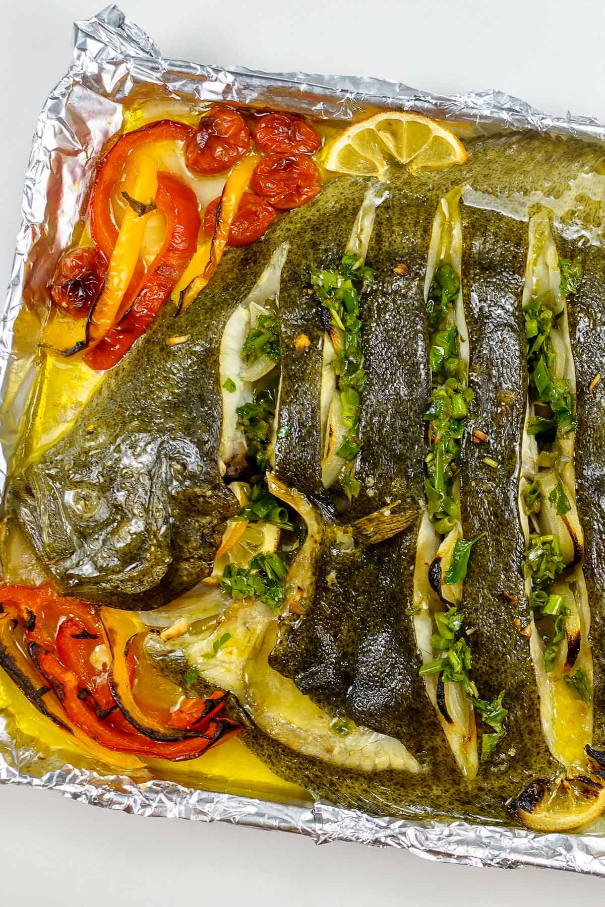A tray with whole baked turbot