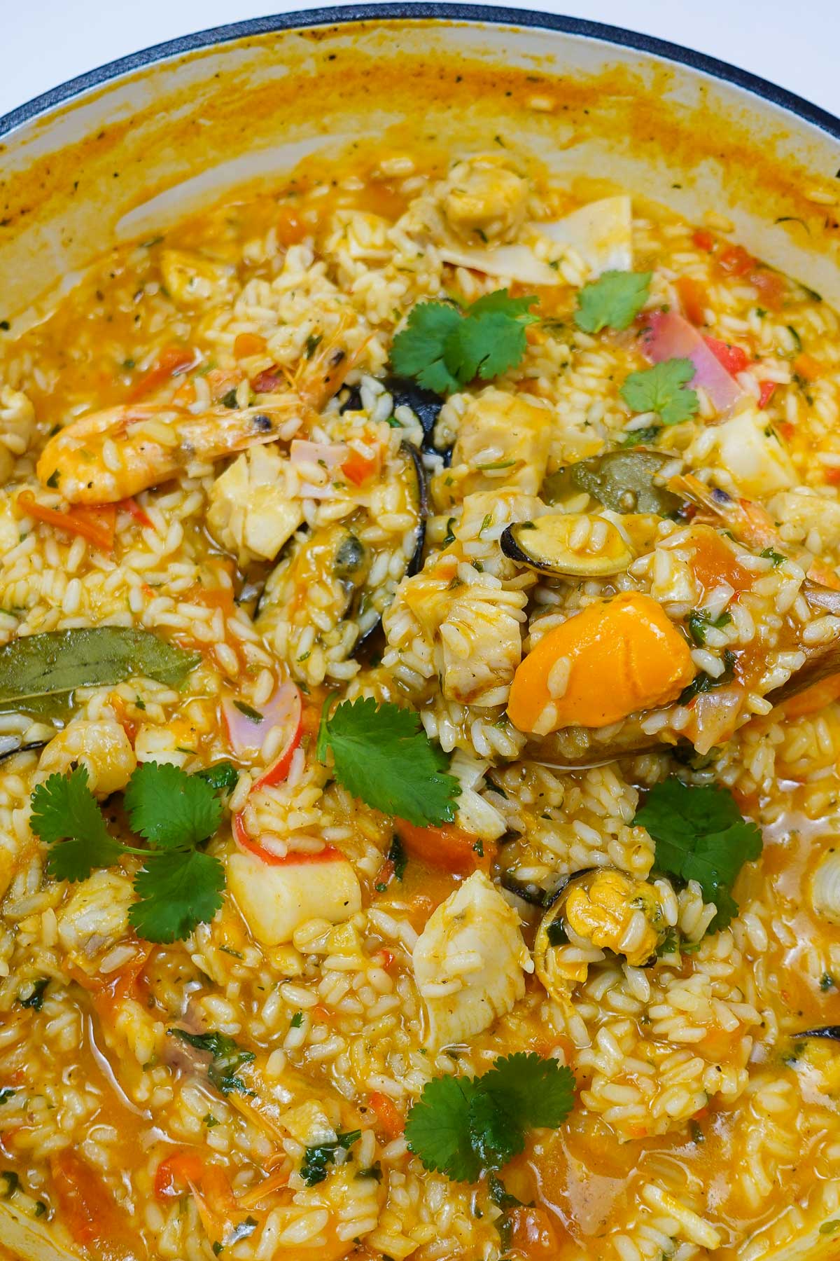 A pot with cooked creamy and mouthwatering Portuguese seafood rice