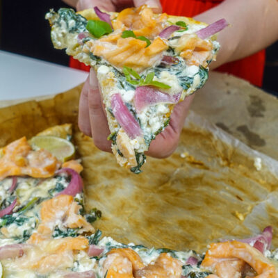 Helena is holding a piece of smoked salmon tart with cottage cheese