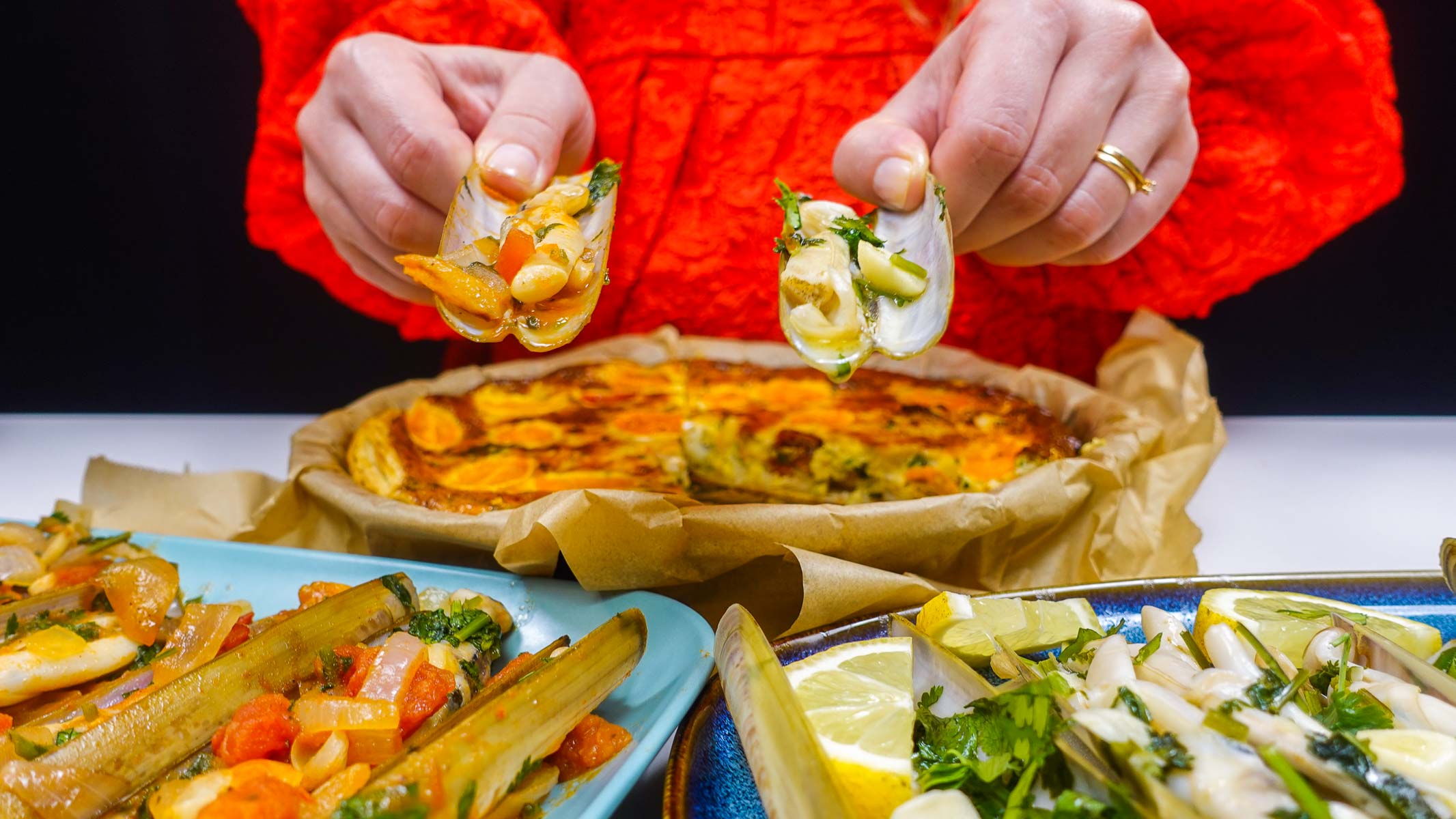 Helena is holding razor clams in two hands