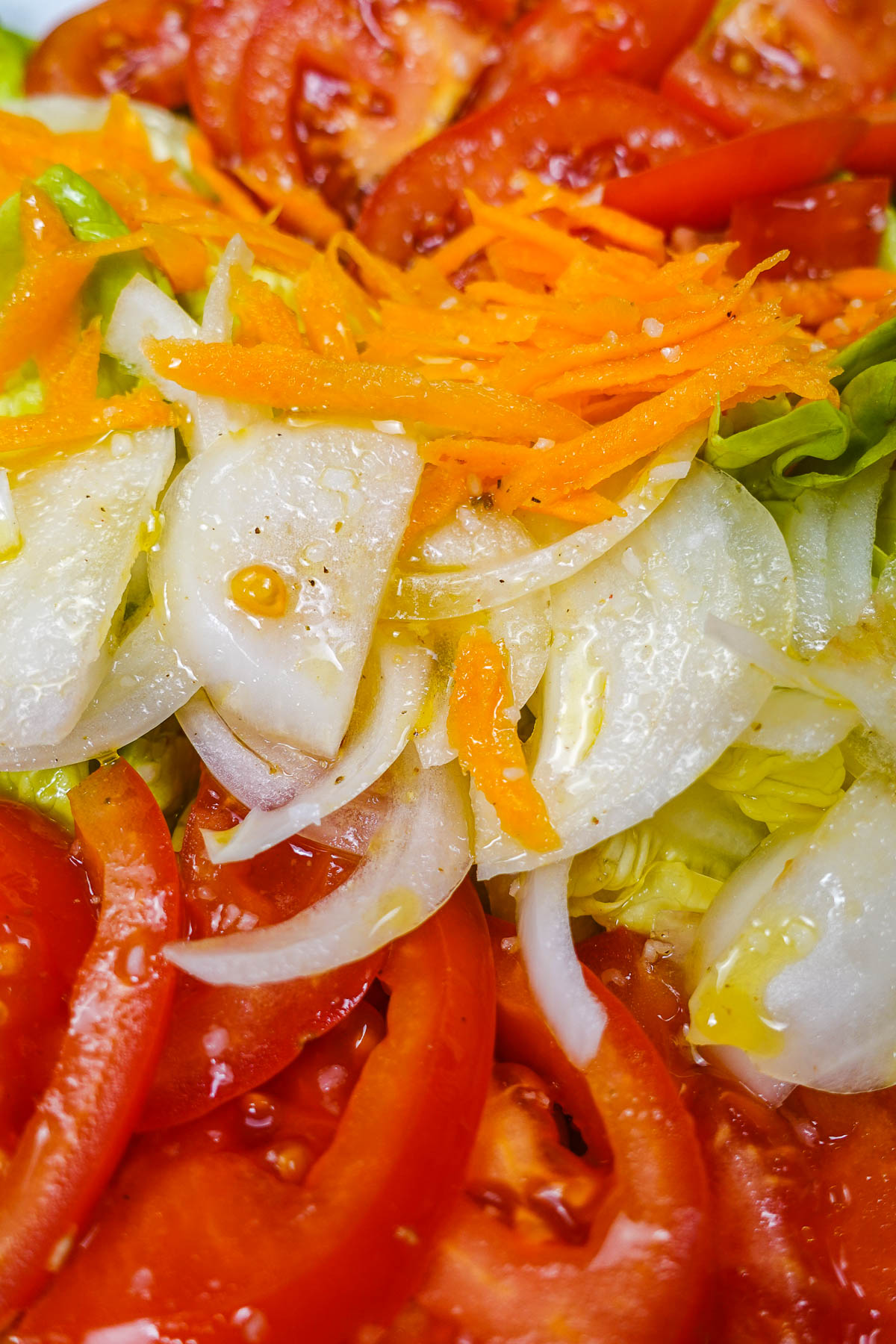A closeup of Portuguese Mixed Salad Salada Mista with olive oil on top.