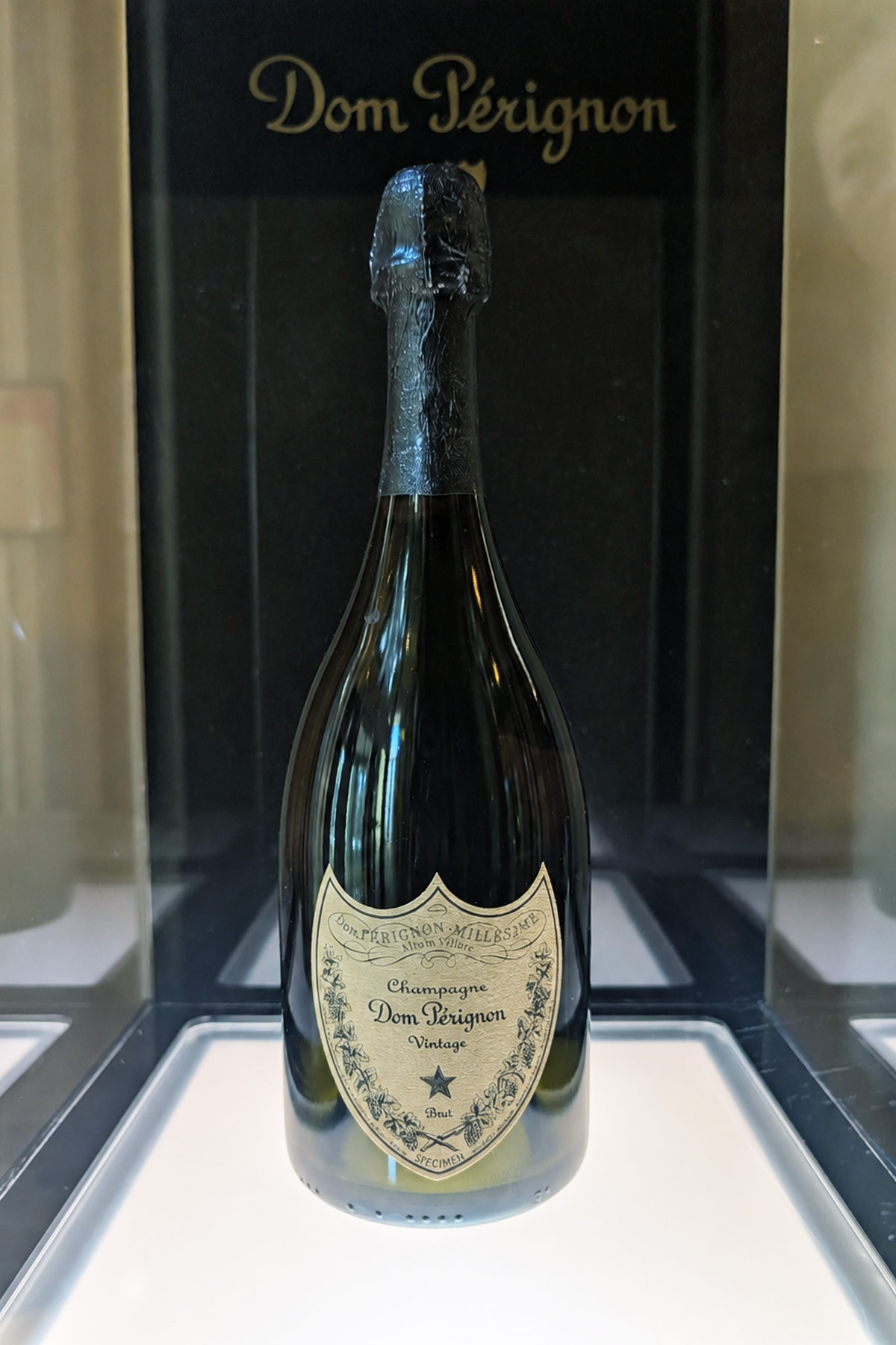 Bottle of Dom Pérignon vintage champagne with black foil.