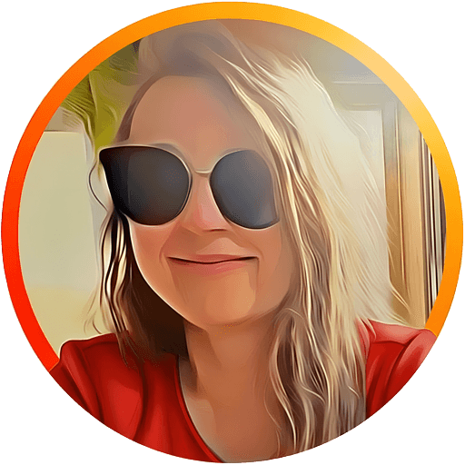 Helena wearing sunglasses smiling indoors with light hair.